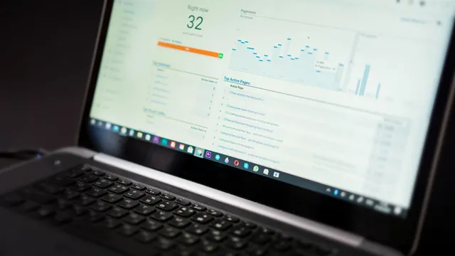 Laptop screen showing a website analytics dashboard with a performance score and traffic charts